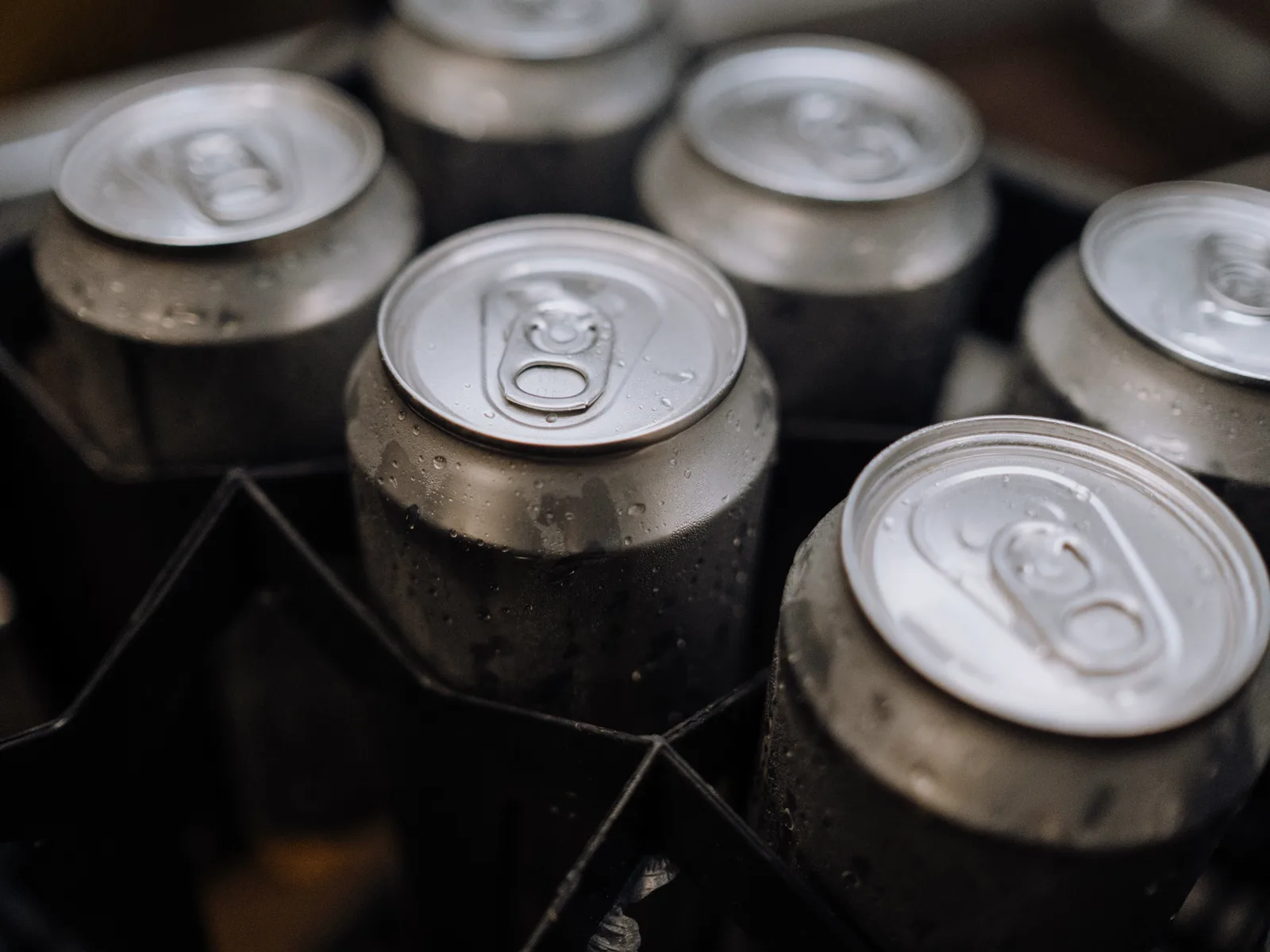 Unbranded aluminum cans in a production crate.